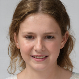 Joyful white child female with medium  brown hair and grey eyes