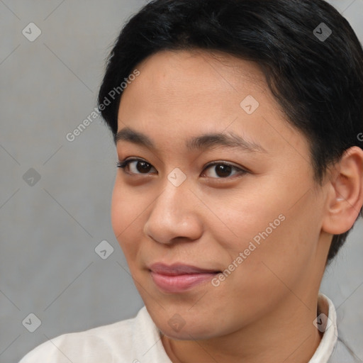 Joyful asian young-adult female with short  brown hair and brown eyes