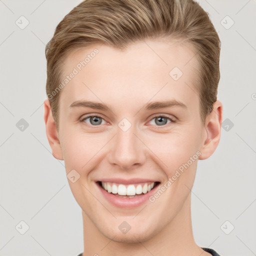 Joyful white young-adult female with short  brown hair and grey eyes