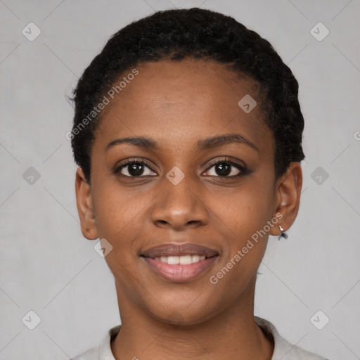 Joyful black young-adult female with short  black hair and brown eyes