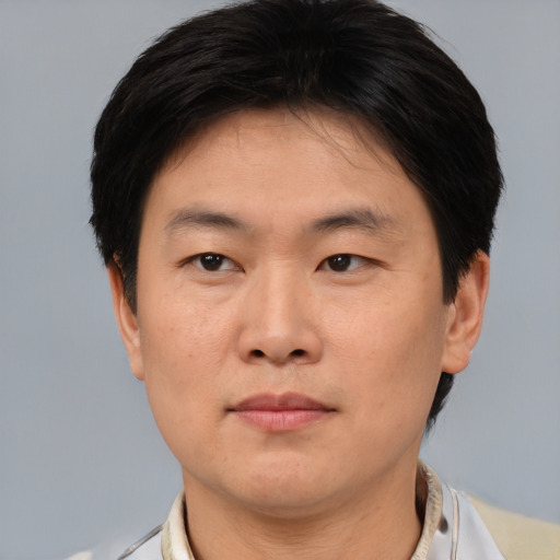 Neutral asian young-adult male with short  brown hair and brown eyes