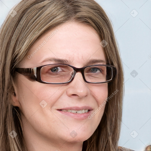 Joyful white young-adult female with long  brown hair and blue eyes