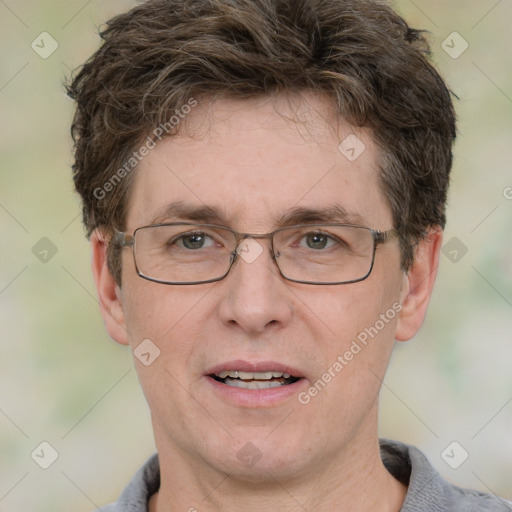 Joyful white adult male with short  brown hair and grey eyes