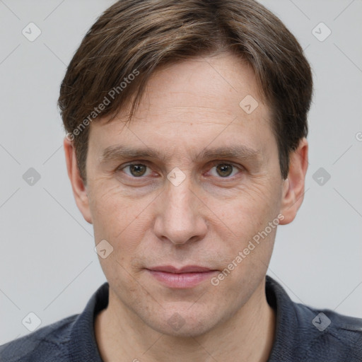 Joyful white adult male with short  brown hair and grey eyes