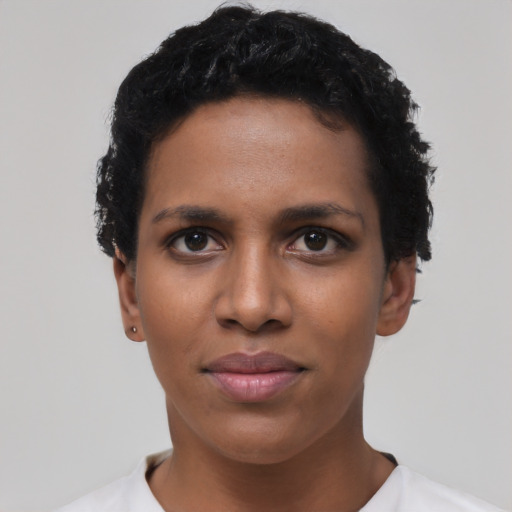 Joyful latino young-adult female with short  black hair and brown eyes