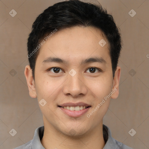 Joyful latino young-adult male with short  brown hair and brown eyes