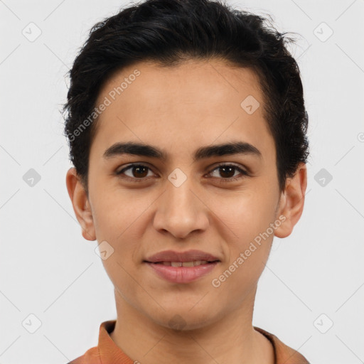 Joyful latino young-adult male with short  brown hair and brown eyes