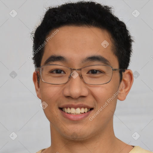 Joyful latino young-adult male with short  brown hair and brown eyes