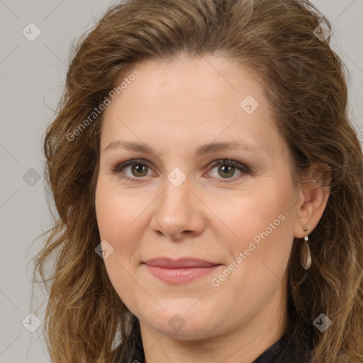 Joyful white adult female with long  brown hair and brown eyes