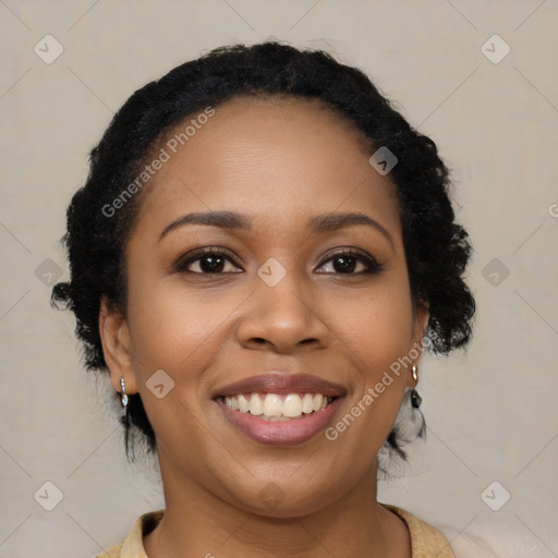 Joyful black young-adult female with medium  brown hair and brown eyes