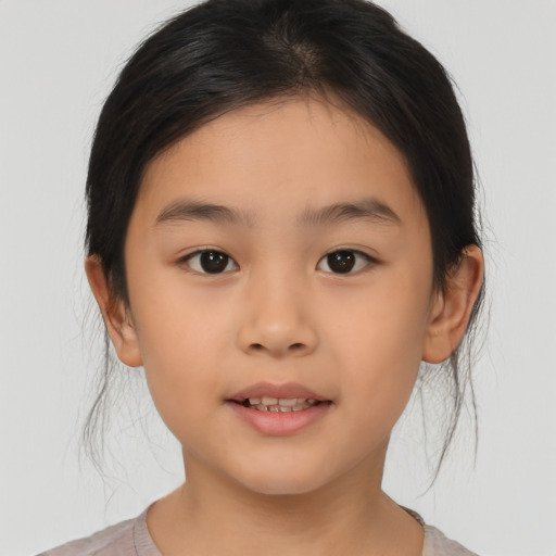 Joyful asian child female with medium  brown hair and brown eyes