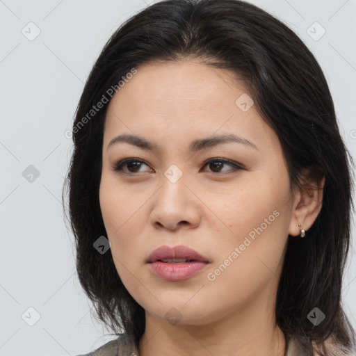 Joyful asian young-adult female with long  brown hair and brown eyes