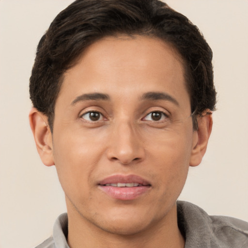 Joyful white adult male with short  brown hair and brown eyes