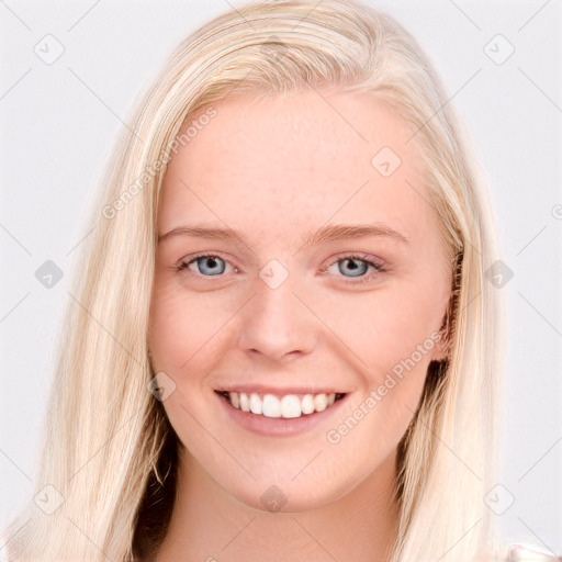 Joyful white young-adult female with long  brown hair and blue eyes