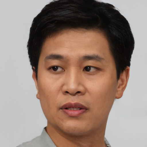 Neutral asian young-adult male with short  black hair and brown eyes