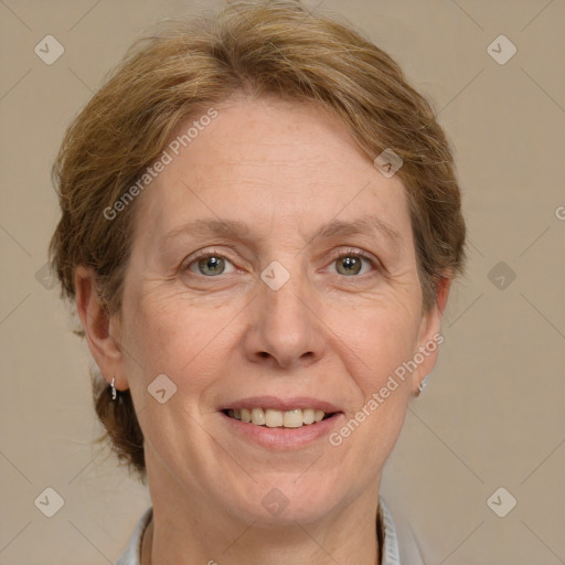 Joyful white adult female with medium  brown hair and grey eyes