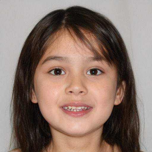 Joyful white child female with medium  brown hair and brown eyes