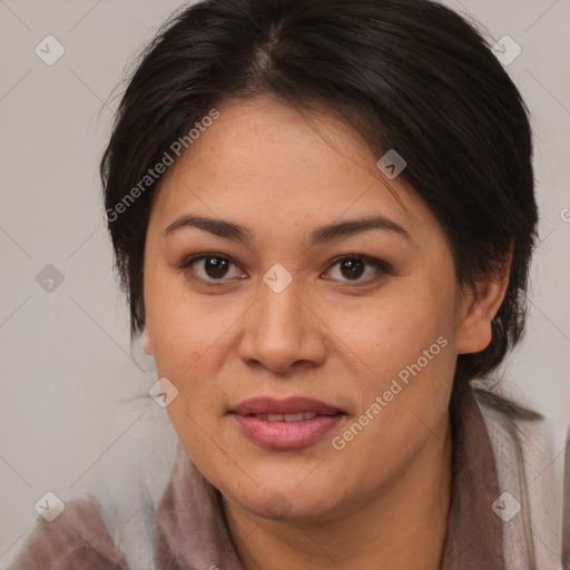 Joyful latino adult female with medium  brown hair and brown eyes