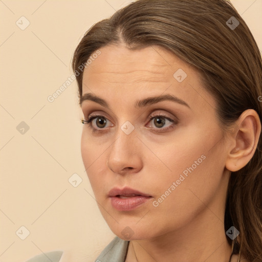 Neutral white young-adult female with long  brown hair and brown eyes