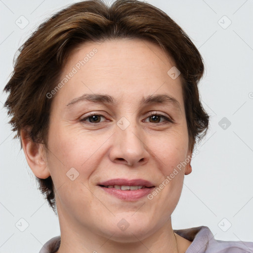 Joyful white adult female with short  brown hair and brown eyes