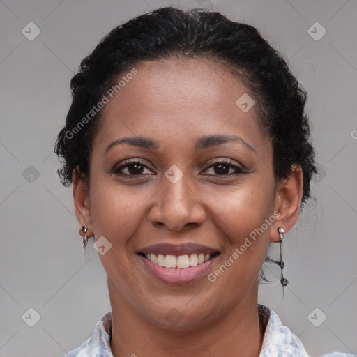 Joyful black young-adult female with medium  brown hair and brown eyes