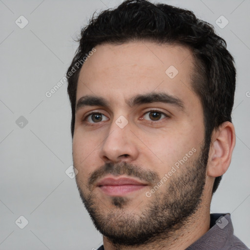 Neutral white young-adult male with short  black hair and brown eyes