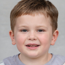 Joyful white child male with short  brown hair and brown eyes