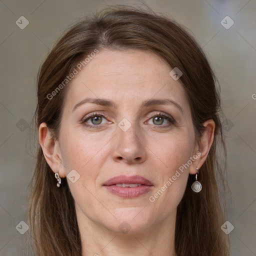 Joyful white adult female with medium  brown hair and grey eyes