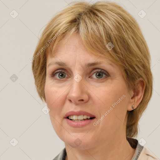 Joyful white adult female with medium  brown hair and grey eyes