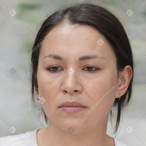 Joyful white adult female with medium  brown hair and brown eyes