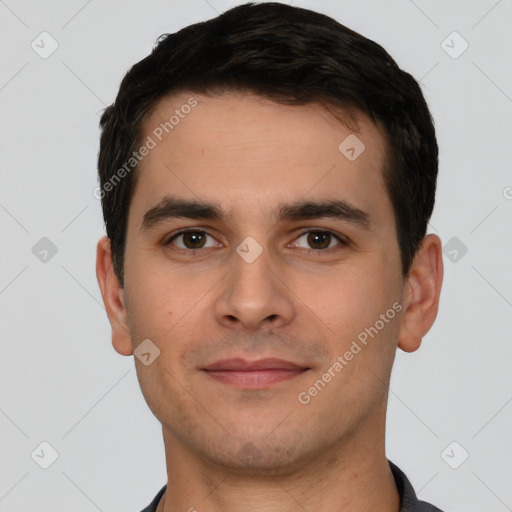 Joyful white young-adult male with short  black hair and brown eyes