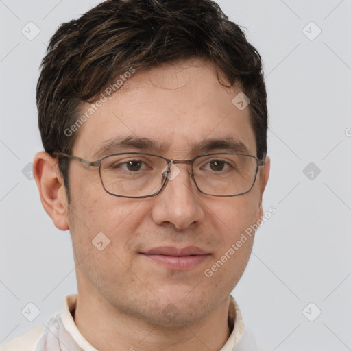 Joyful white adult male with short  brown hair and brown eyes