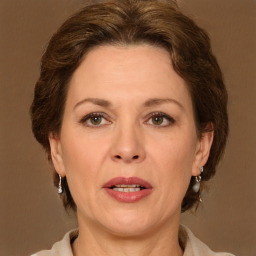 Joyful white adult female with short  brown hair and brown eyes