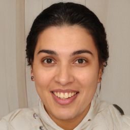 Joyful white young-adult female with medium  brown hair and brown eyes