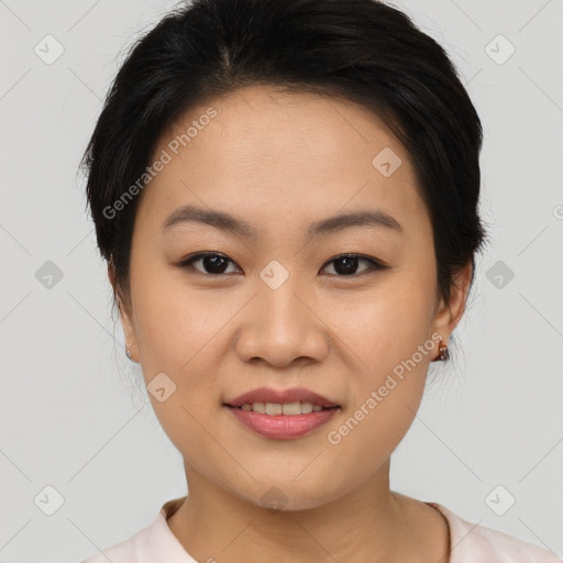 Joyful asian young-adult female with short  brown hair and brown eyes