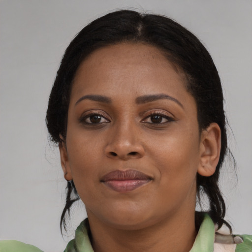 Joyful asian young-adult female with medium  black hair and brown eyes