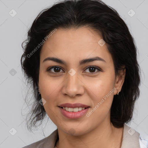 Joyful latino young-adult female with medium  brown hair and brown eyes