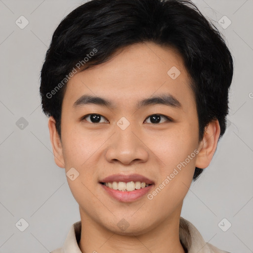 Joyful asian young-adult male with short  black hair and brown eyes