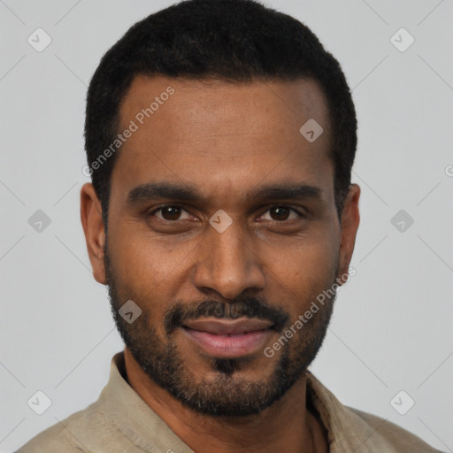 Joyful black young-adult male with short  black hair and brown eyes