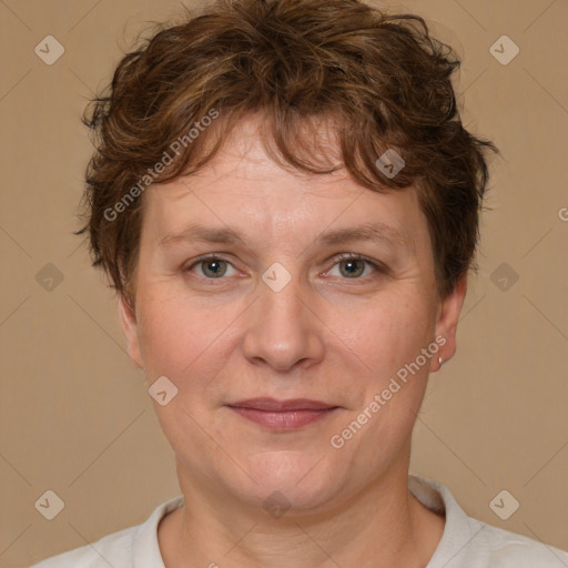 Joyful white adult female with short  brown hair and brown eyes