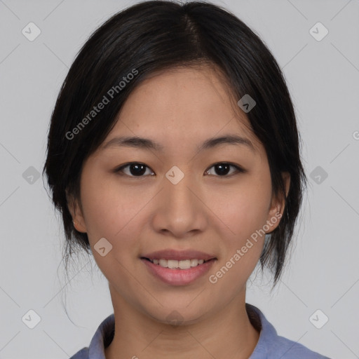 Joyful asian young-adult female with medium  black hair and brown eyes