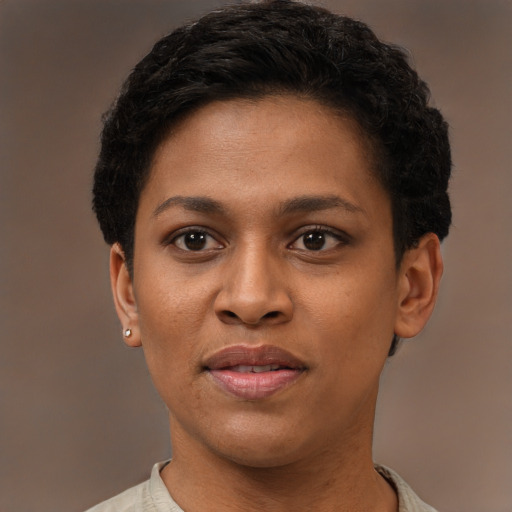 Joyful black young-adult female with short  brown hair and brown eyes