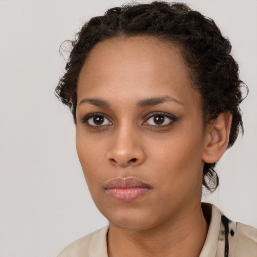 Neutral black young-adult female with short  brown hair and brown eyes