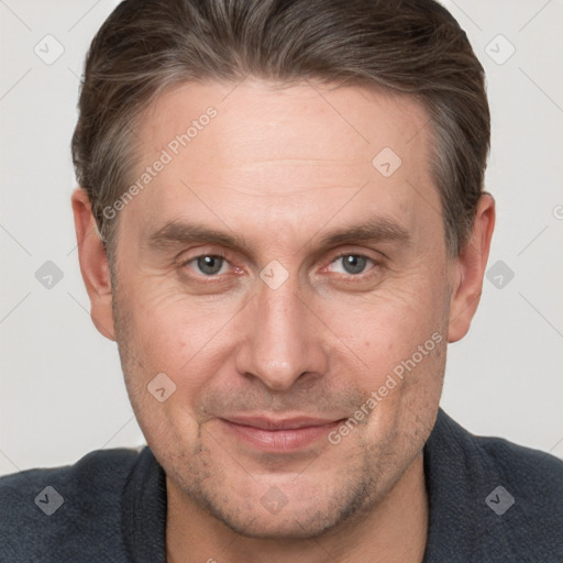 Joyful white adult male with short  brown hair and grey eyes