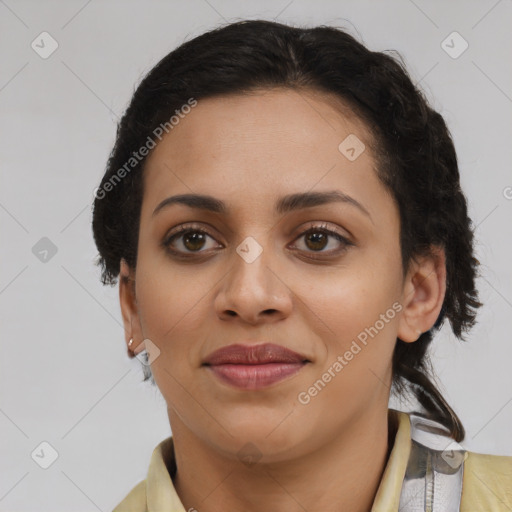 Joyful latino young-adult female with medium  brown hair and brown eyes