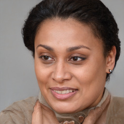 Joyful white adult female with short  brown hair and brown eyes