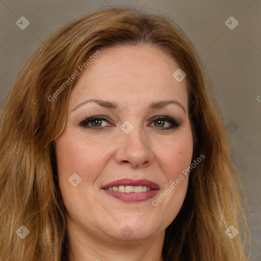 Joyful white adult female with long  brown hair and brown eyes