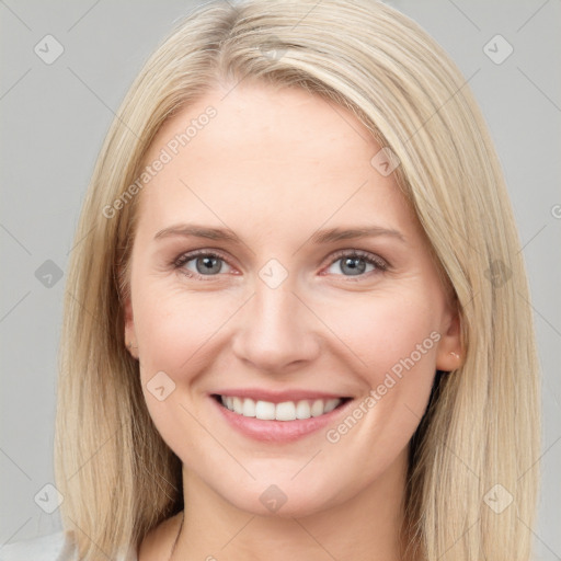 Joyful white young-adult female with long  brown hair and blue eyes