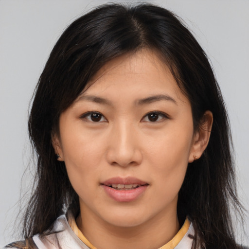 Joyful asian young-adult female with medium  brown hair and brown eyes