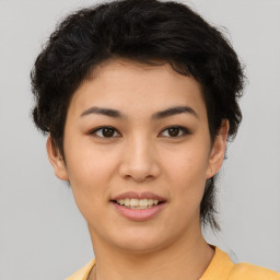 Joyful asian young-adult female with short  brown hair and brown eyes